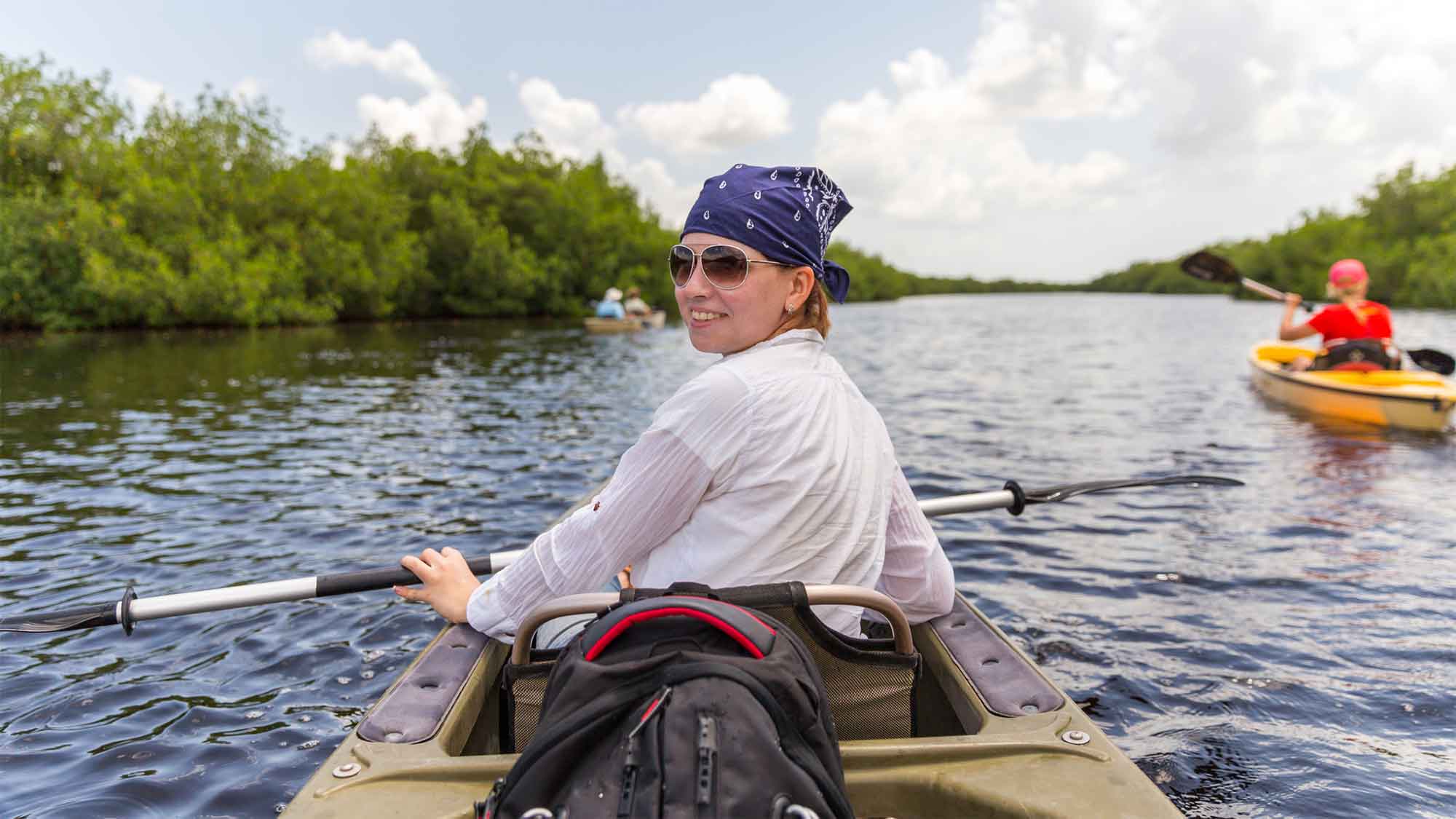 Female paddling a kayak in The Everglades